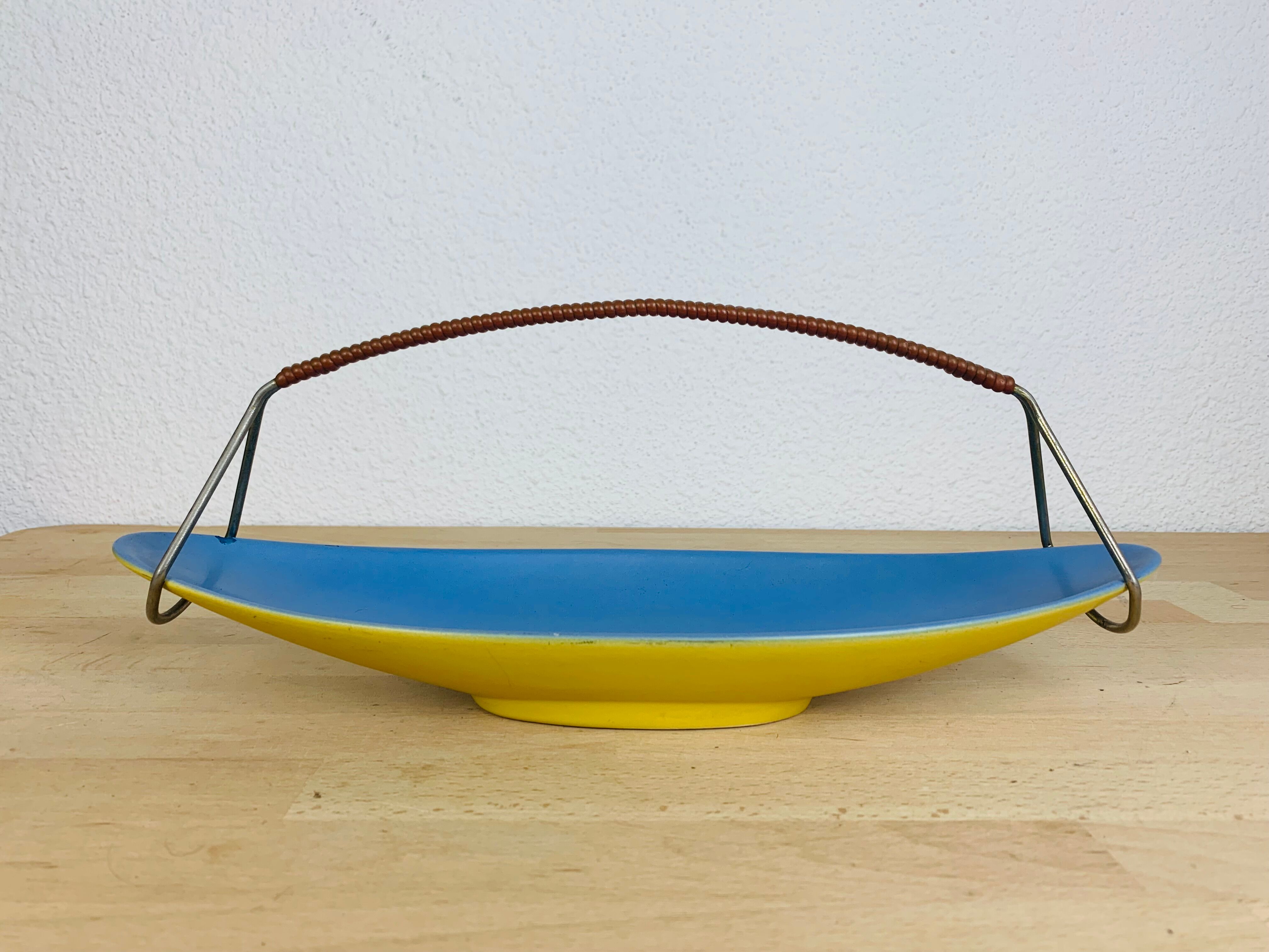 Empty ceramic shuttle pocket from the 50s