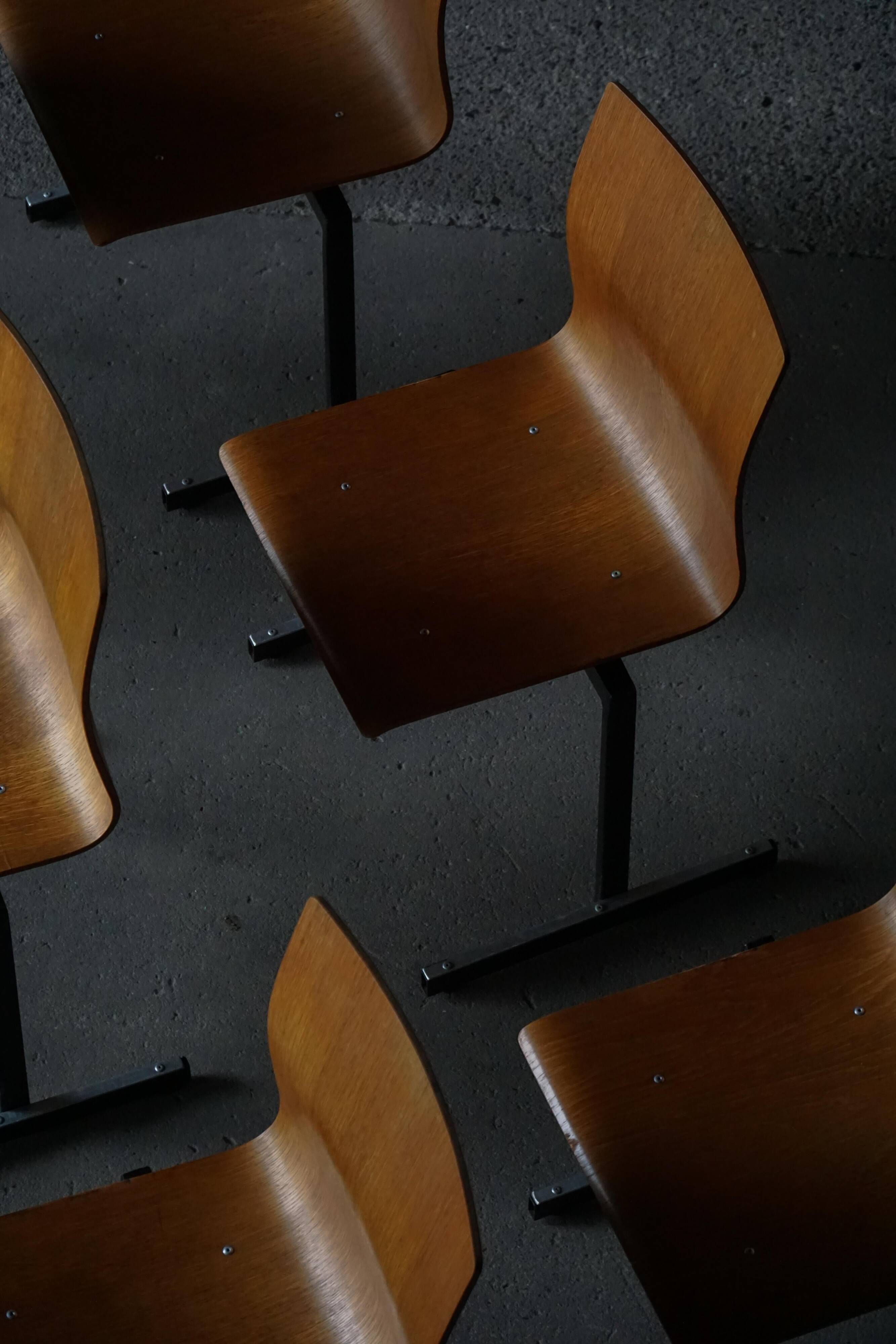 Set of 6 industrial stackable chairs by Niels Larsen, black metal and oak, 1960s.
