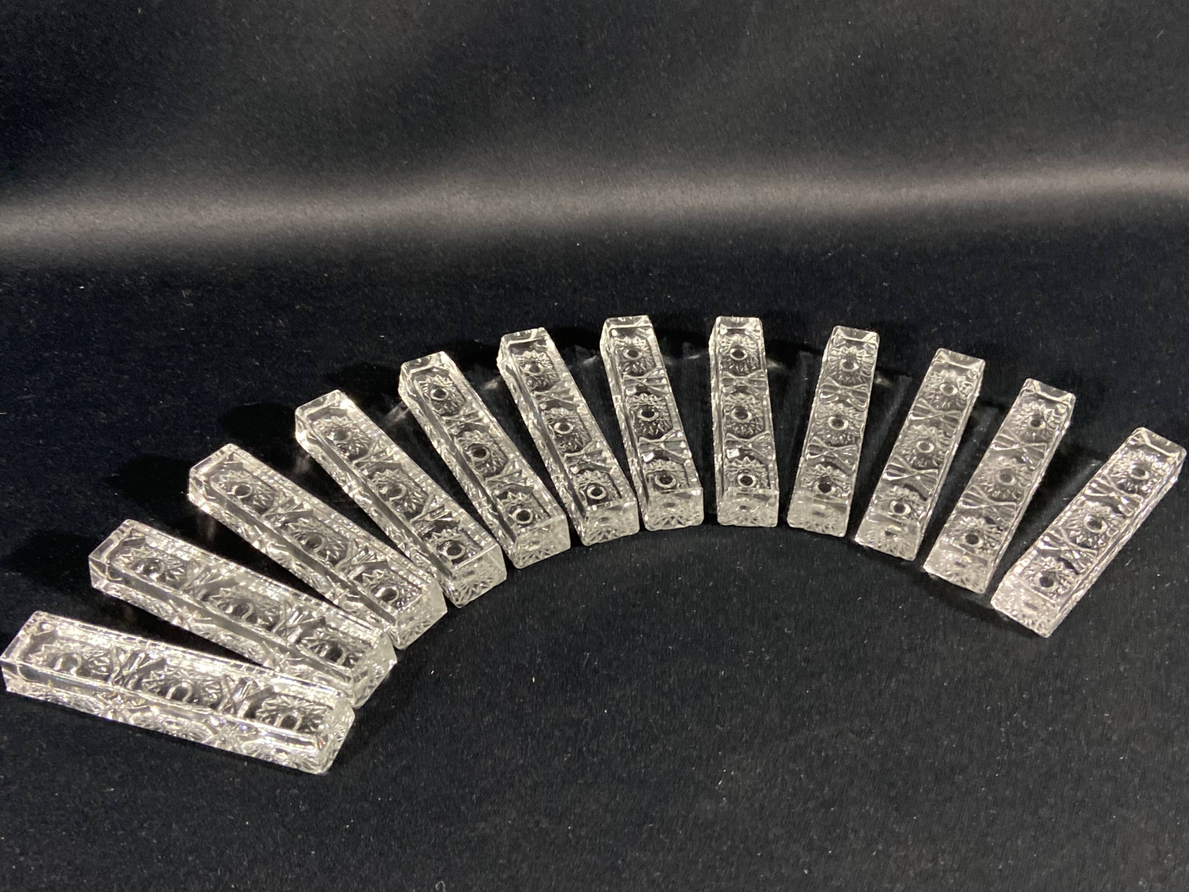Set of 12 molded glass or crystal knife rests with diamond point decor