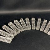 Set of 12 molded glass or crystal knife rests with diamond point decor