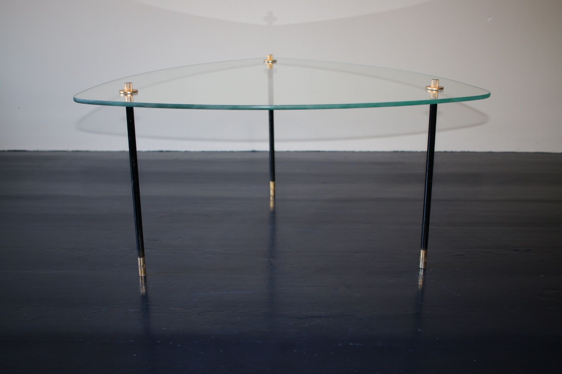Vintage glass and black-painted brass side table