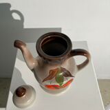 Vintage stoneware teapot with flower and fruit patterns