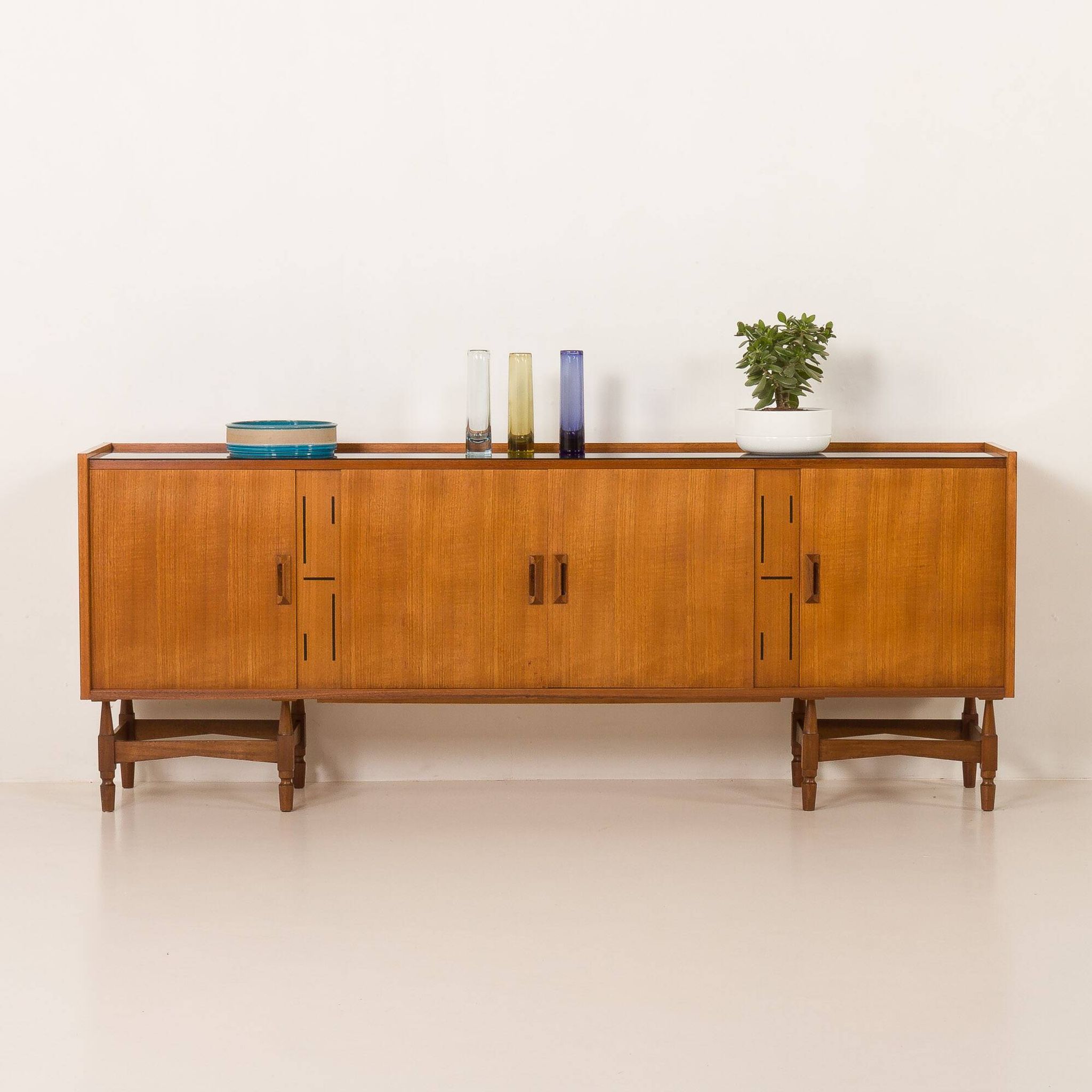 Itaian mid century teak sideboard with black glass top and inlays, 1970s