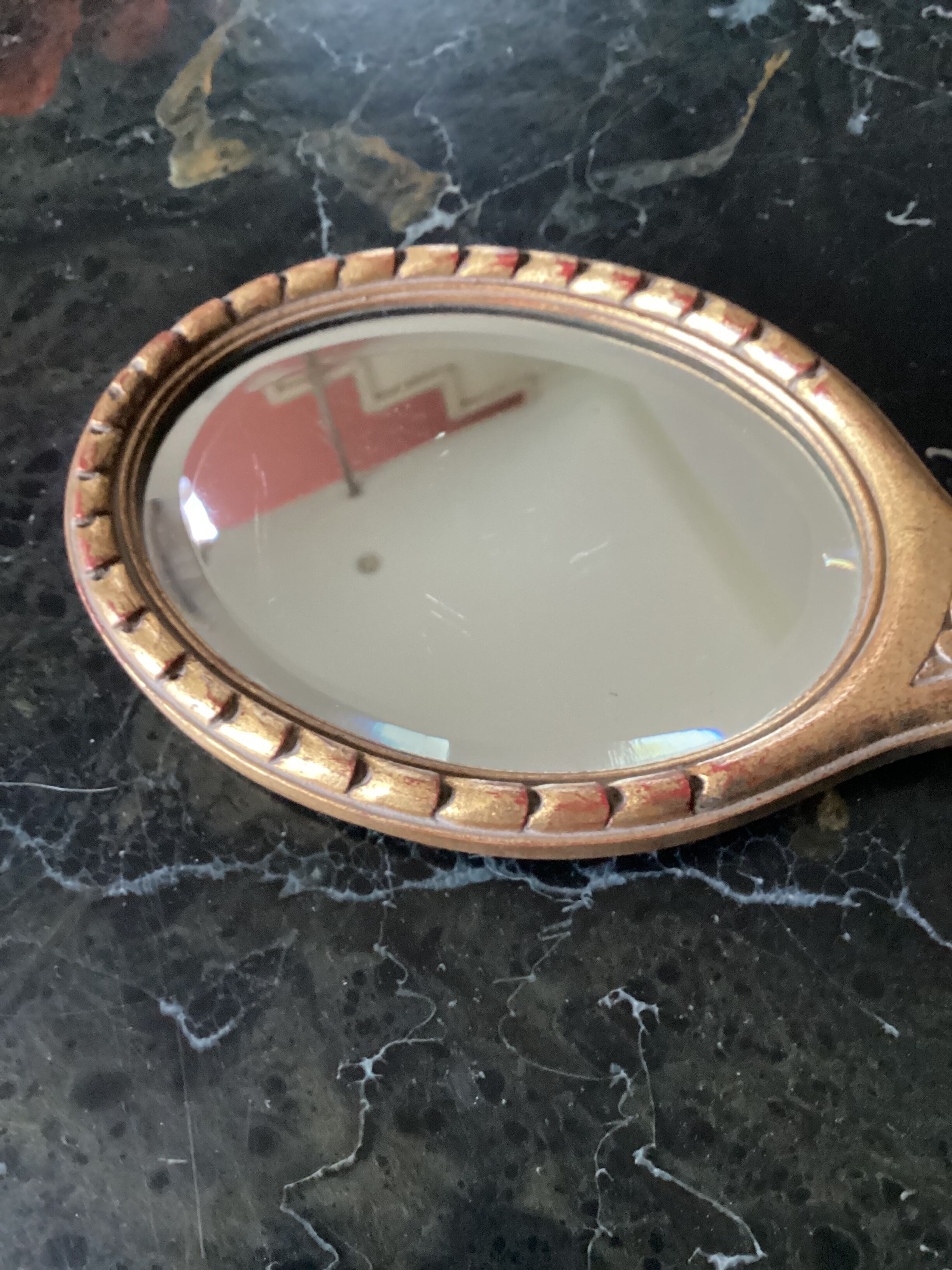 Hand-facing beveled mirror surrounded by wood dimension: height -38cm- width -15.5cm-