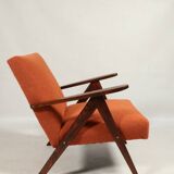 Vintage orange curly armchair Scandinavian design 1970