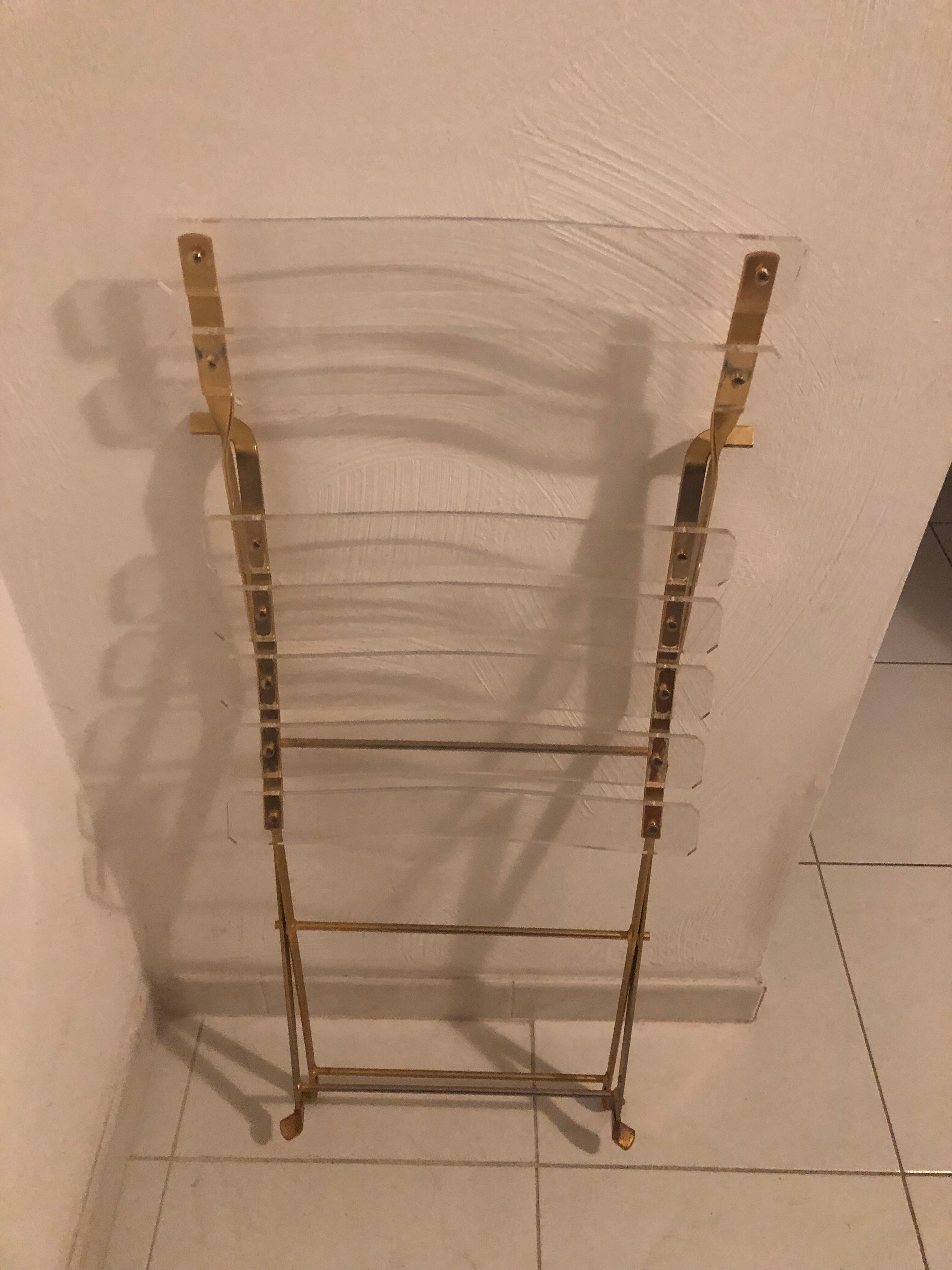 Folding chair in plexiglass and brass