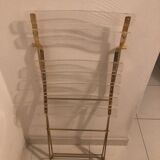 Folding chair in plexiglass and brass