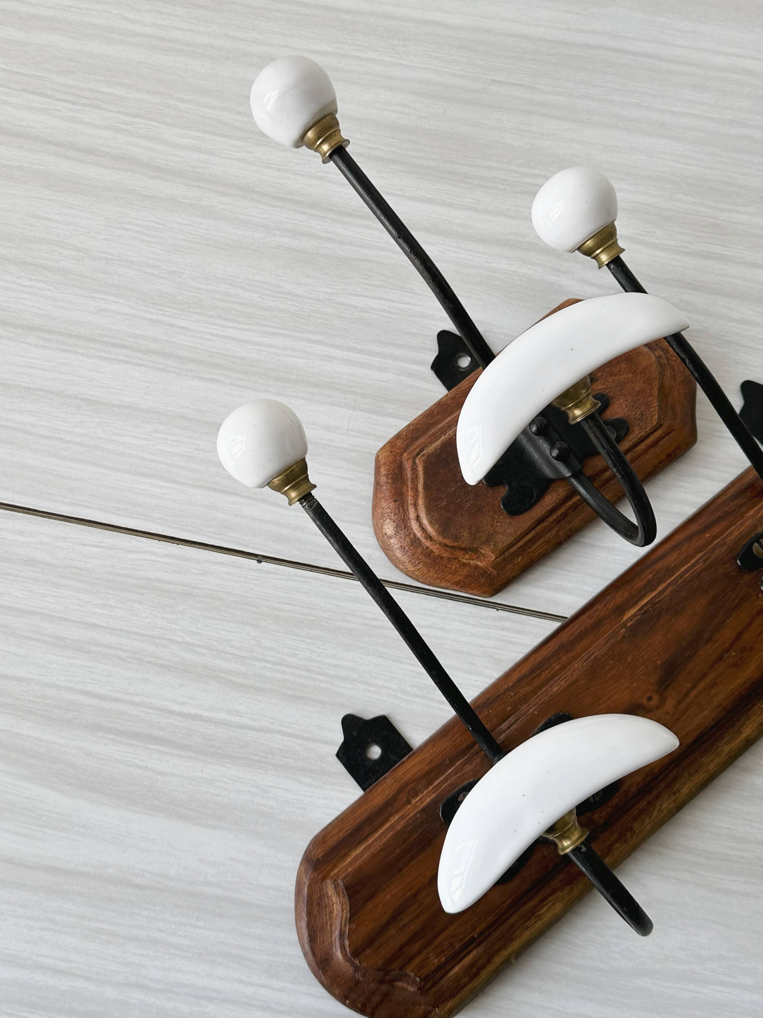 Set of two wooden and porcelain coat hooks