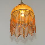 Vintage French amber mottled glass hanging ceiling light with beaded fringe.