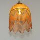 Vintage French amber mottled glass hanging ceiling light with beaded fringe.