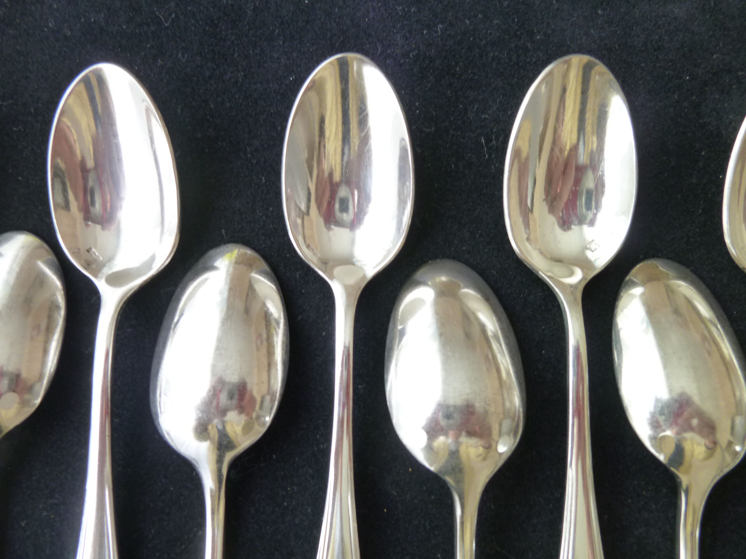 Set of 12 silver metal mocha spoons, crusader ribbon model