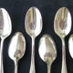Set of 12 silver metal mocha spoons, crusader ribbon model