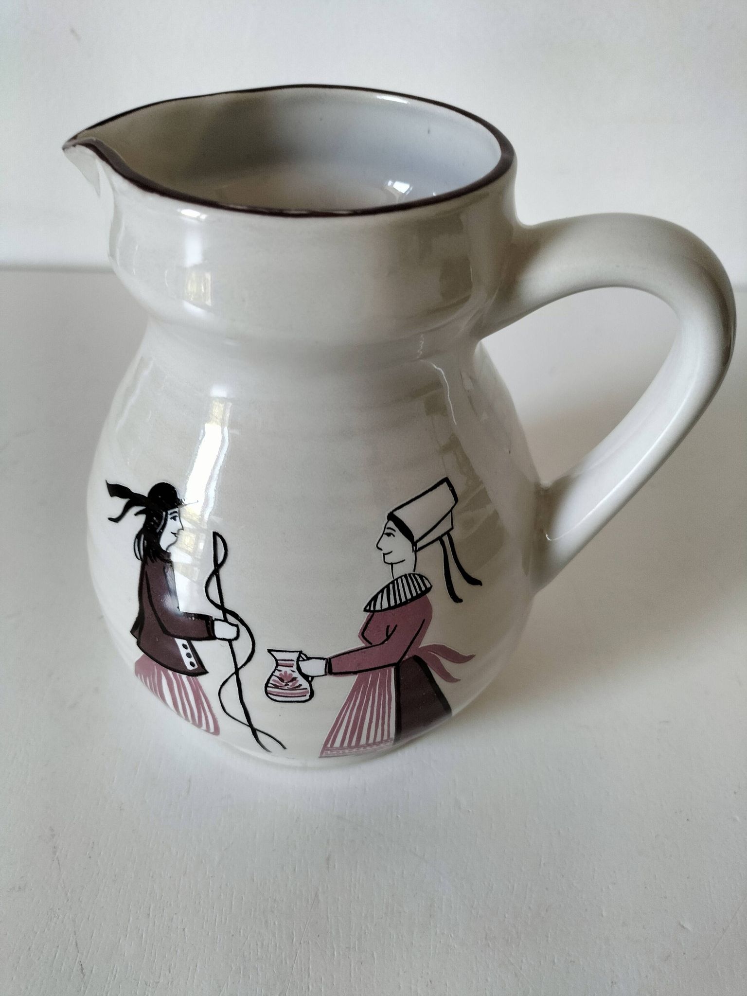 Ceramic pitcher from Quimper, created by Dominique Villard.