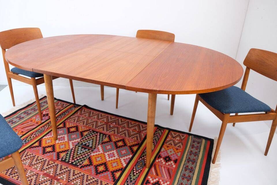 1960s/70s-style teak dining table by ASKO, with a retro vintage design.