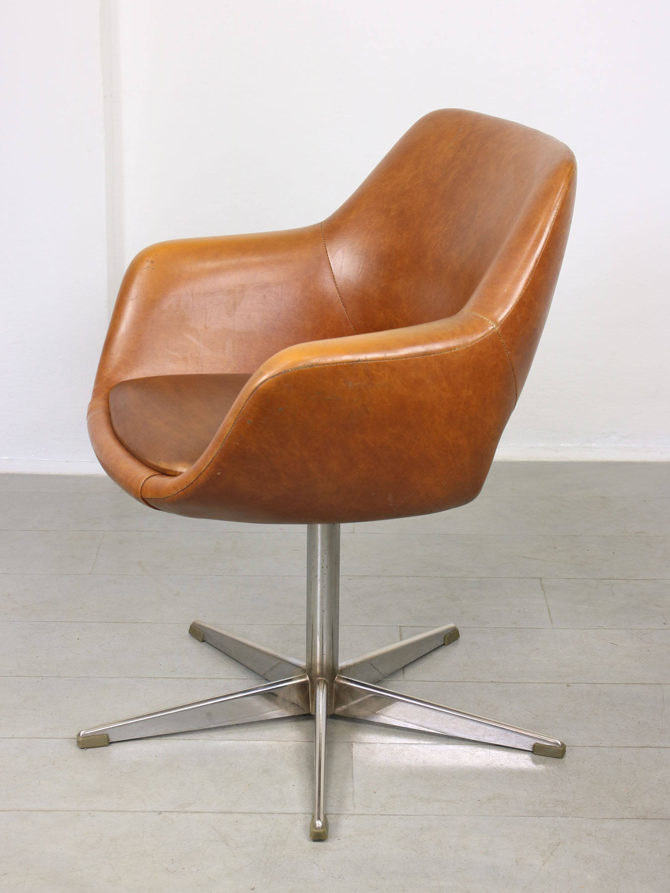 Mid-century brown leatherette swivel chair from Stol