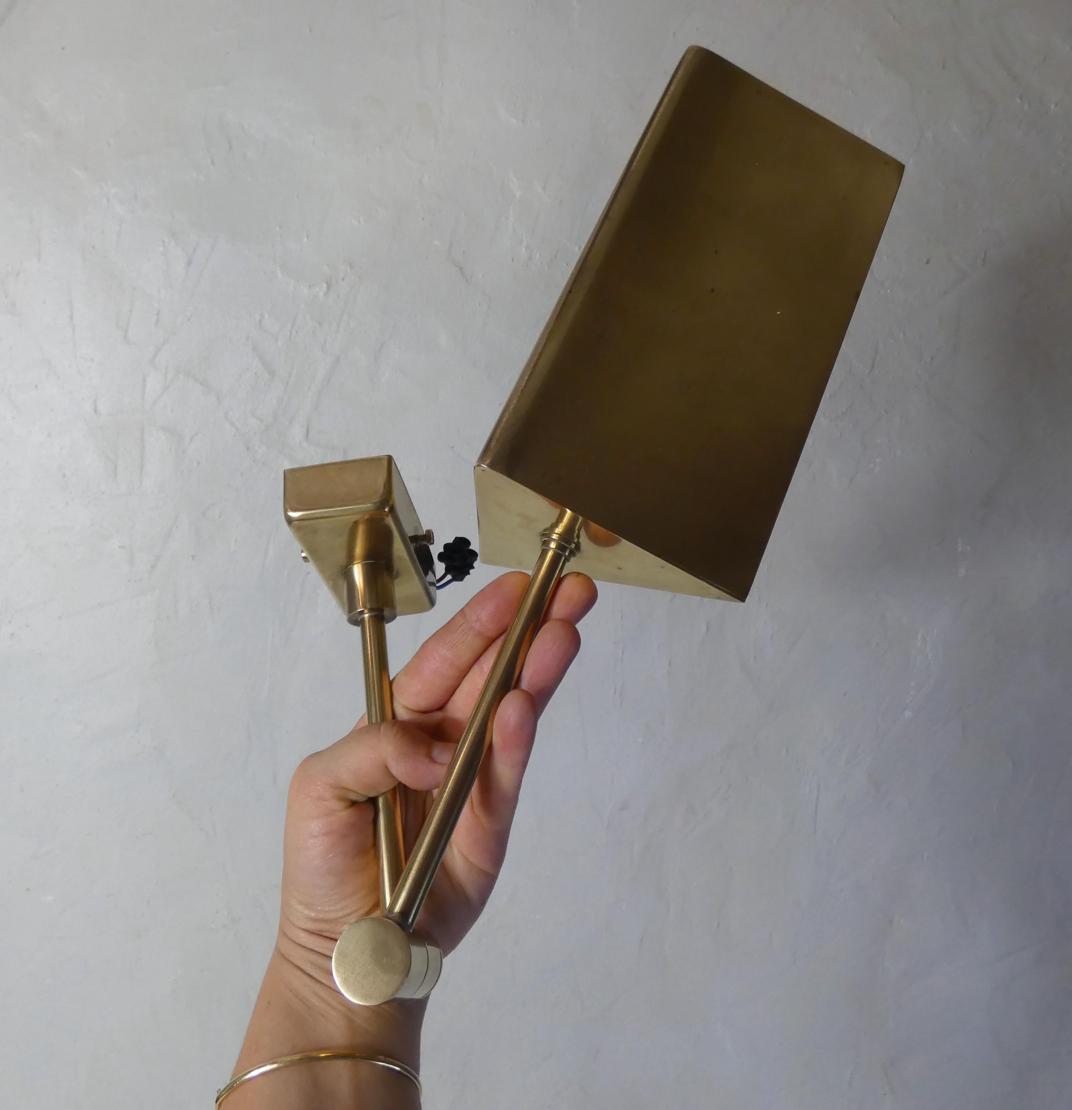 Pair of adjustable brass wall lamps after koch & lowy