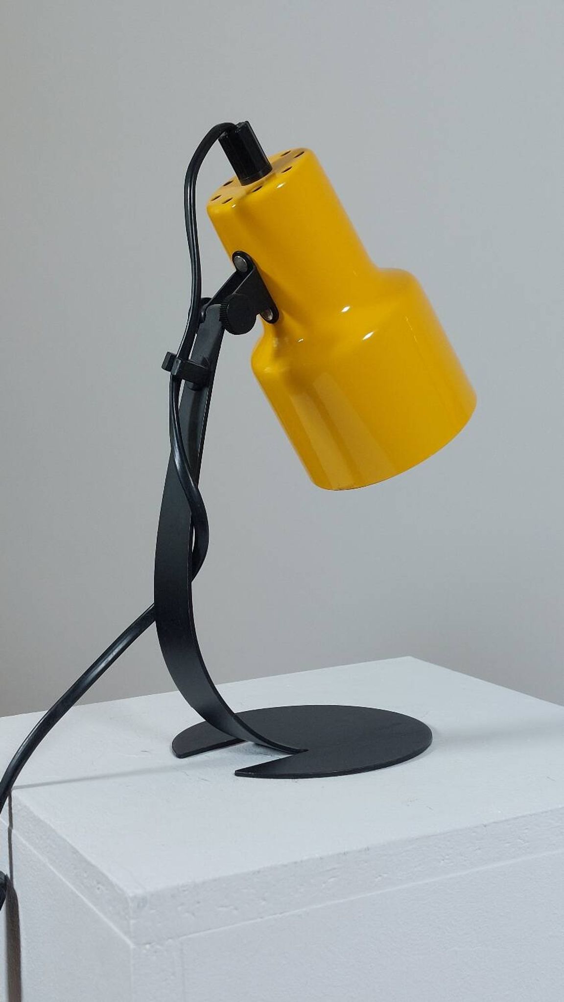 A pair of well-designed minimalist bedside lamps.