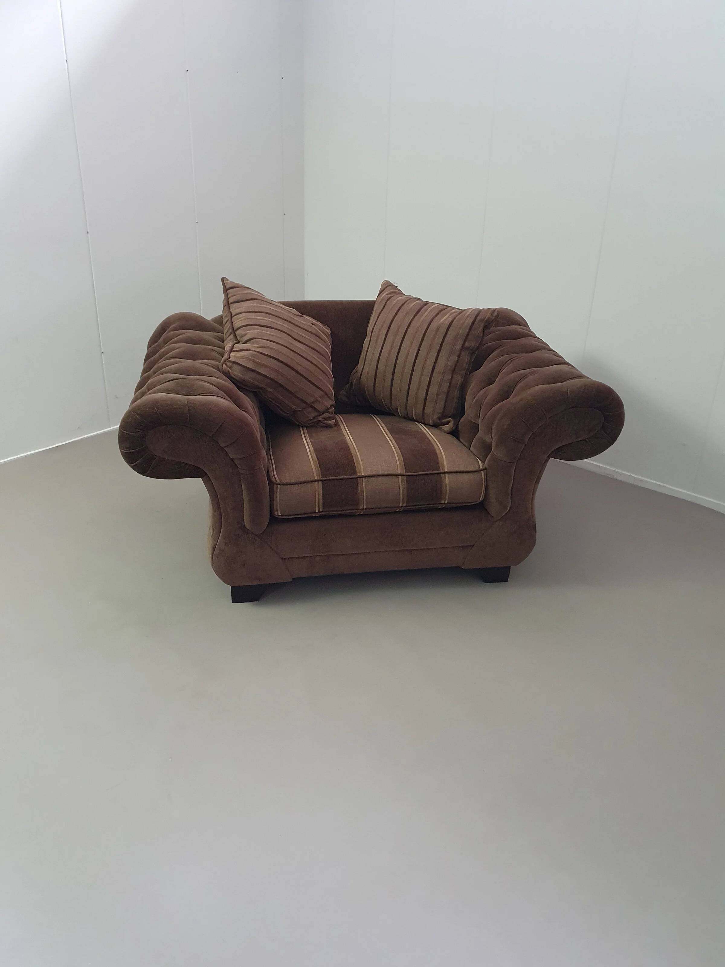 Large weighty love seat with the original matching cushions. Marked "Handmade in Holland"