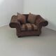Large weighty love seat with the original matching cushions. Marked "Handmade in Holland"