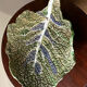 Vintage ceramic leaf-shaped vide poche, signed.