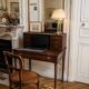 Antique mahogany step desk with a sliding shelf, ideal for small spaces.