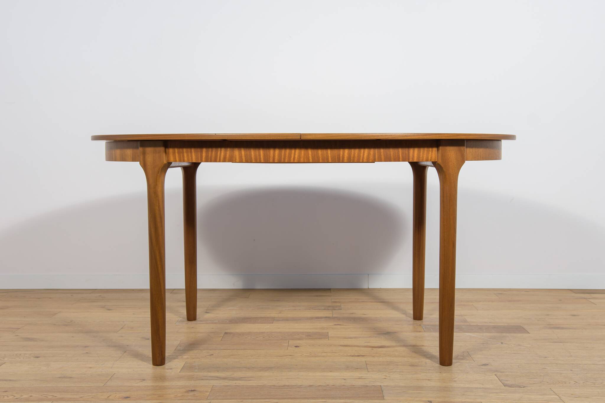 Mid-century extendable oval teak dining table from McIntosh, UK