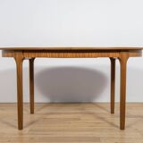 Mid-century extendable oval teak dining table from McIntosh, UK