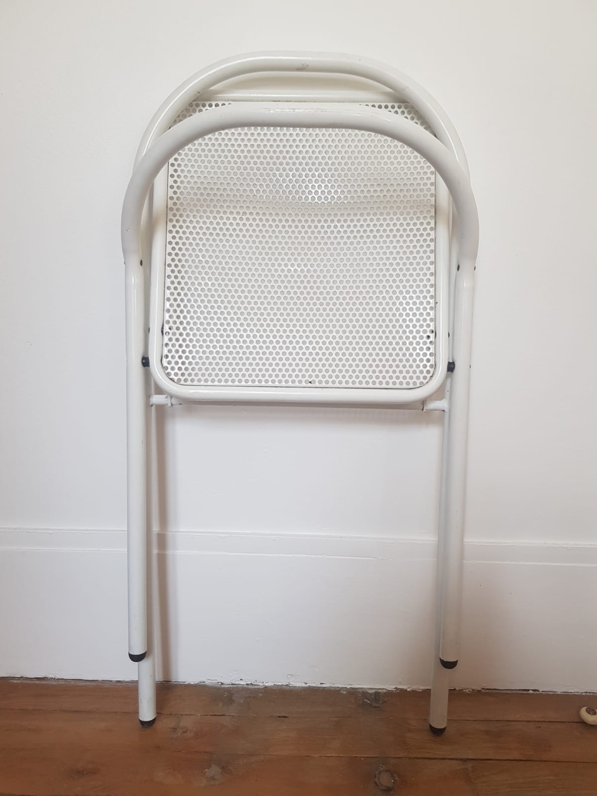 Vintage perforated metal folding chair