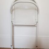 Vintage perforated metal folding chair
