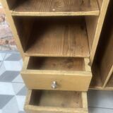 On a piece of furniture with sorting lockers and drawers
