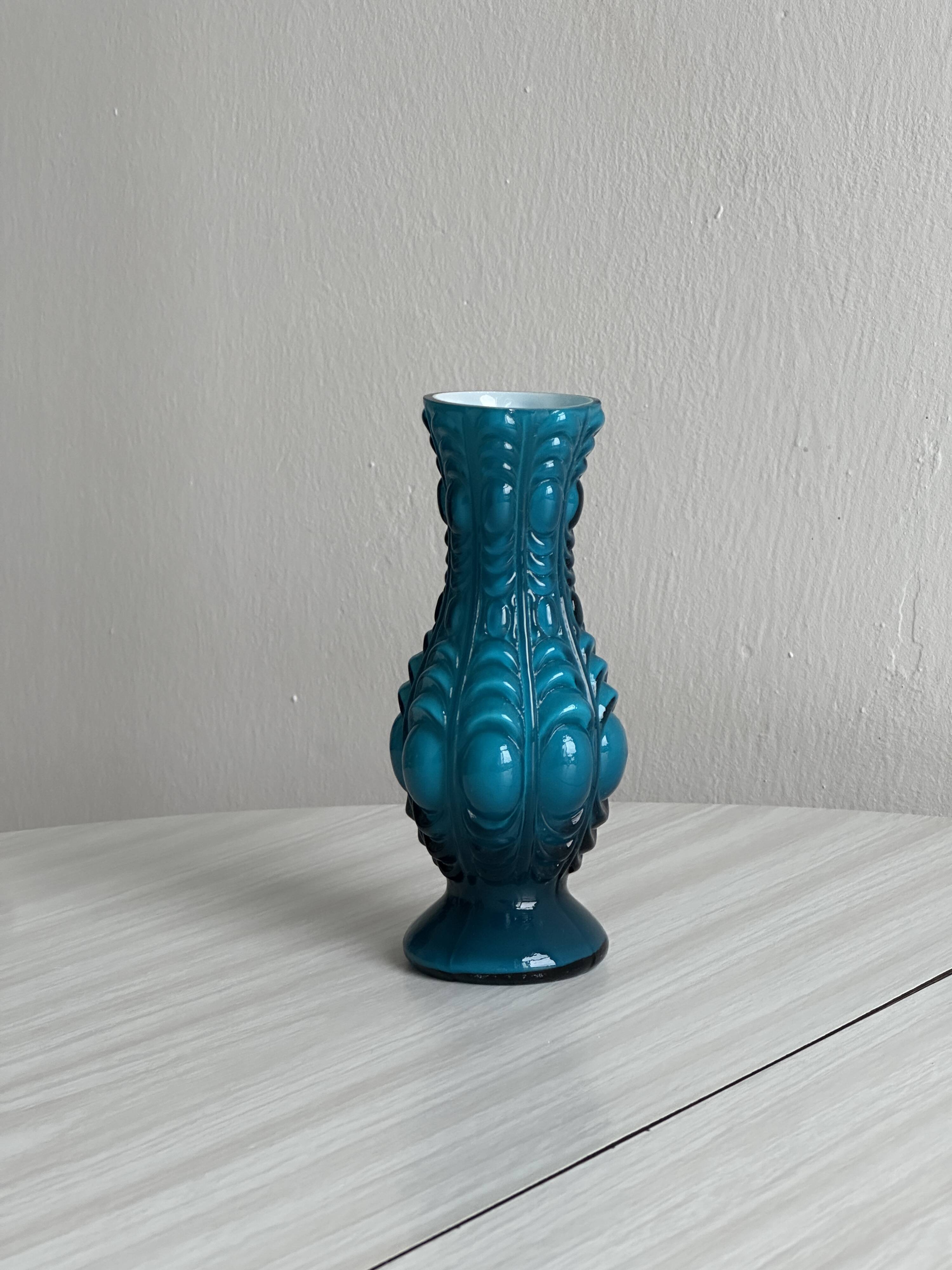 Small deep blue vase with reliefs