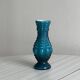 Small deep blue vase with reliefs