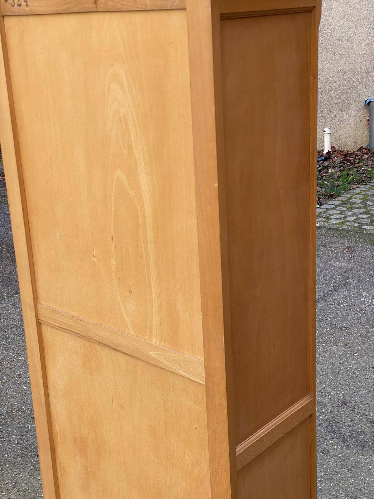 Parisian glass-fronted wardrobe in light wood from the 1960s.