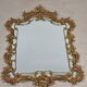 Mirror with baroque style parecloses in bronze 102 x 61 cm