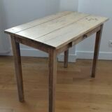 Small old wooden table with inclusion of coins and keys