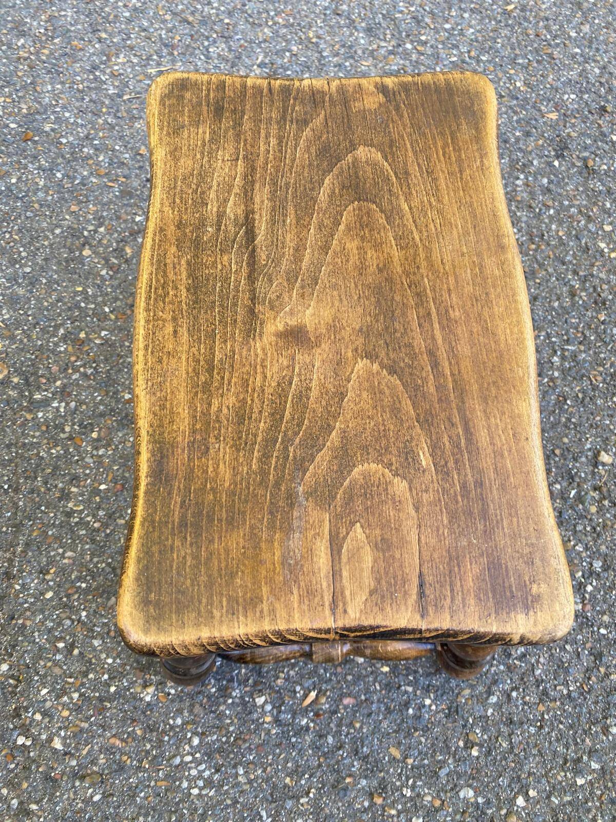 Small vintage low stool made of turned solid wood footrest 1960