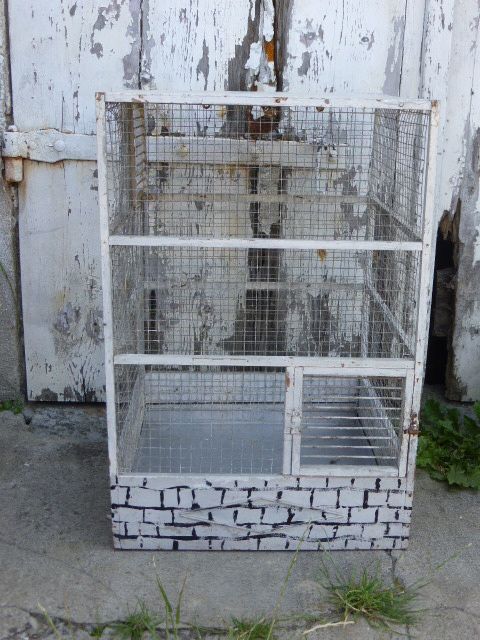 Vintage bird cage, made of wood and chicken wire metal square mesh