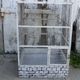 Vintage bird cage, made of wood and chicken wire metal square mesh