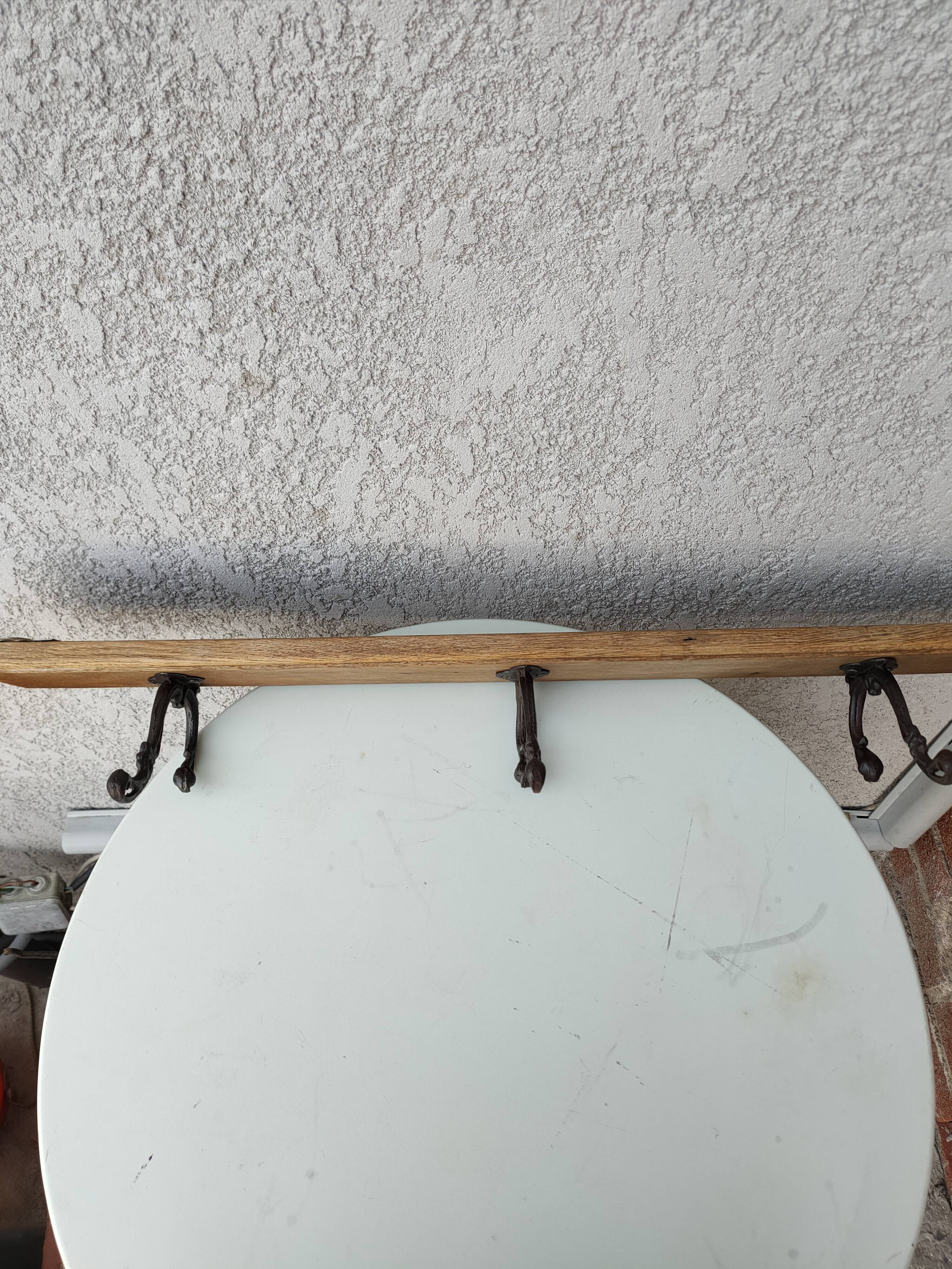 antique coat rack with 3 cast iron hooks