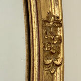 Oval mirror in carved wood