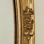Oval mirror in carved wood