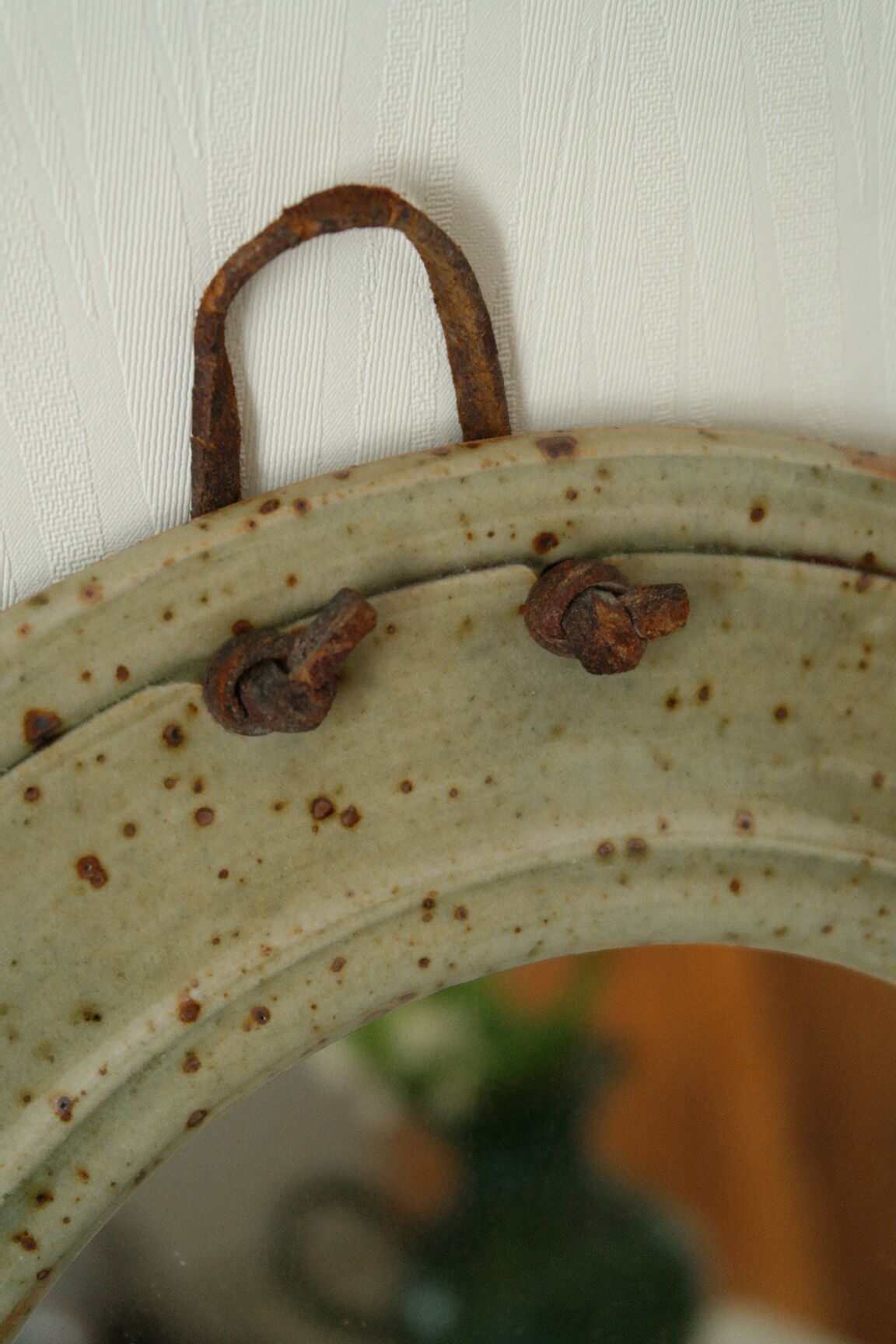 Artisanal round mirror in vintage green sandstone signed