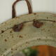 Artisanal round mirror in vintage green sandstone signed