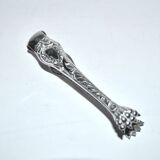 Rocaille sugar tongs in silver metal with lion claw medallion