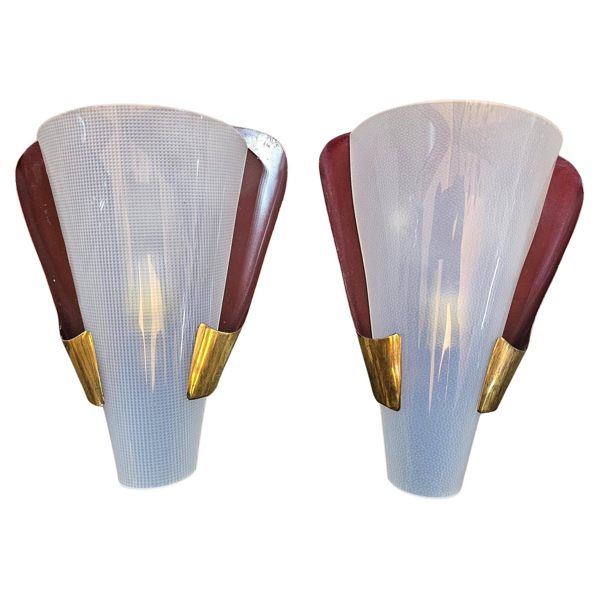Pair of brass wall lights in Mid Century Modern style attributed to Stilnovo.