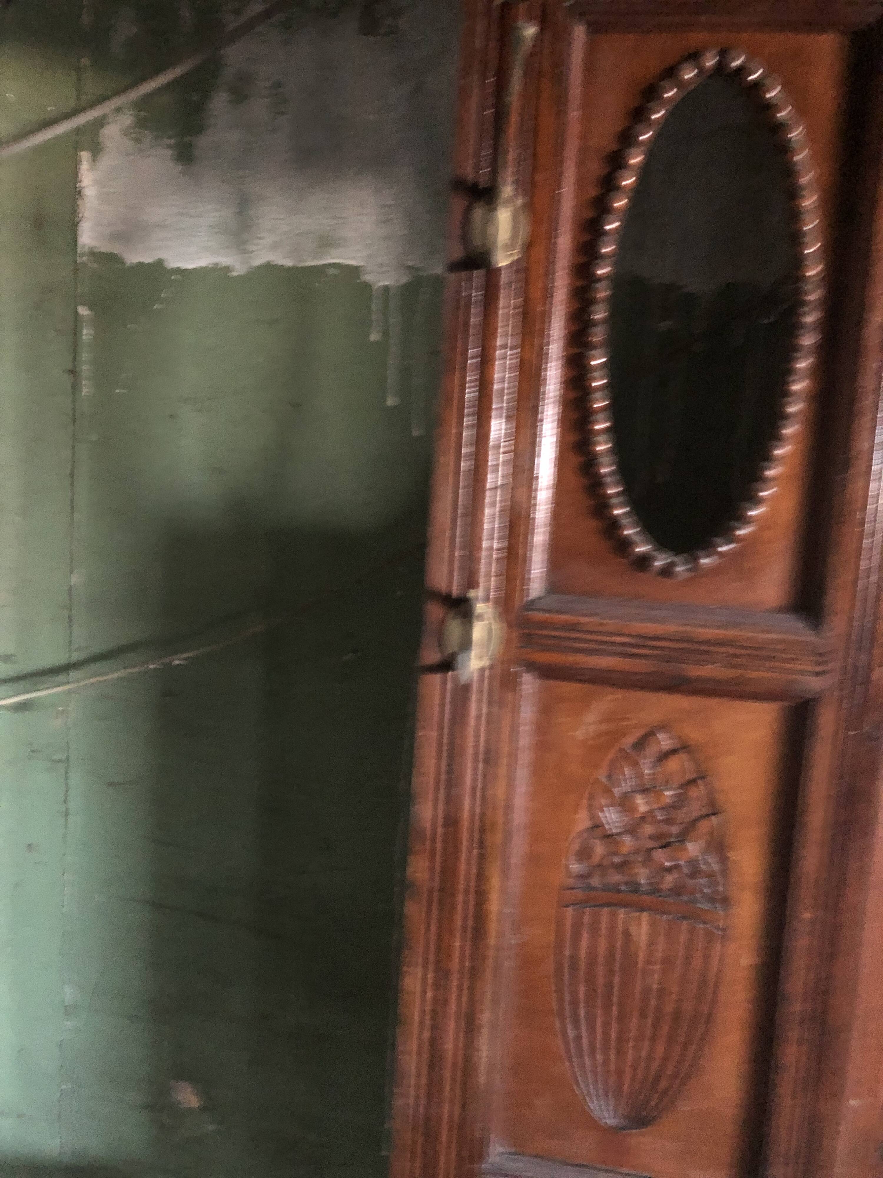 Very decorative coat rack with bevelled mirror.