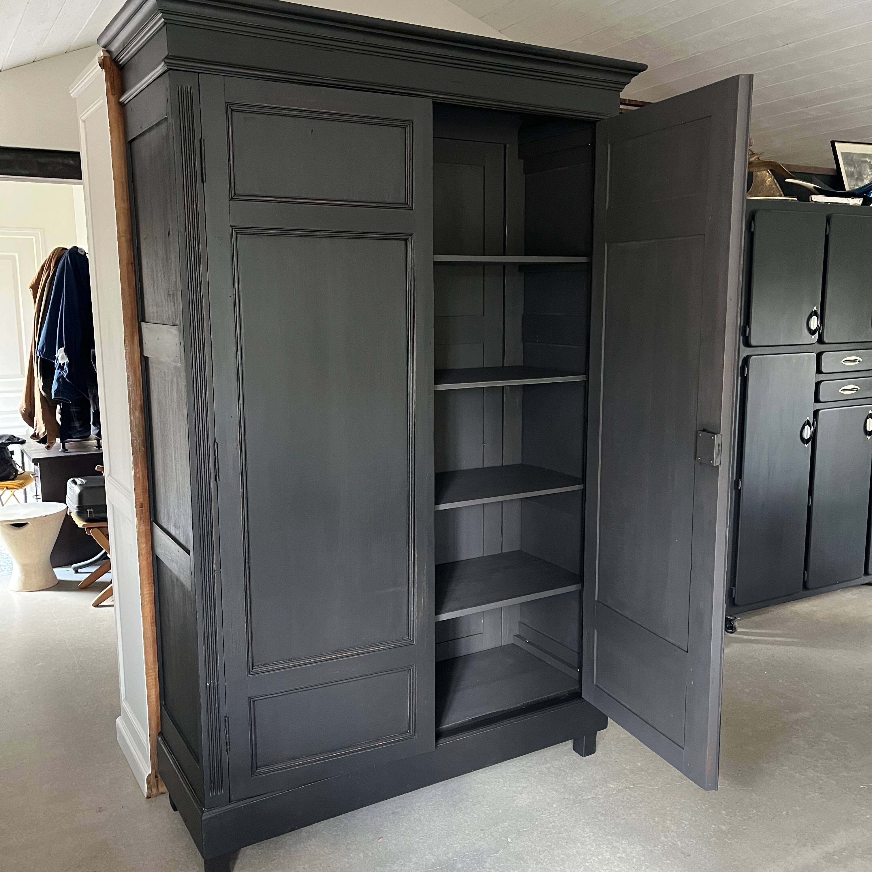 Large black wooden wardrobe