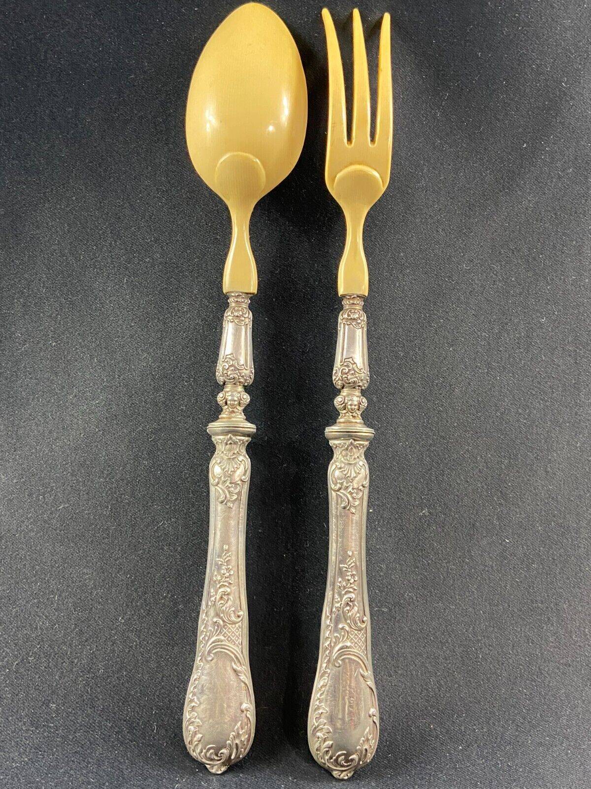 Salad service silver handles Regency decoration with cherub heads