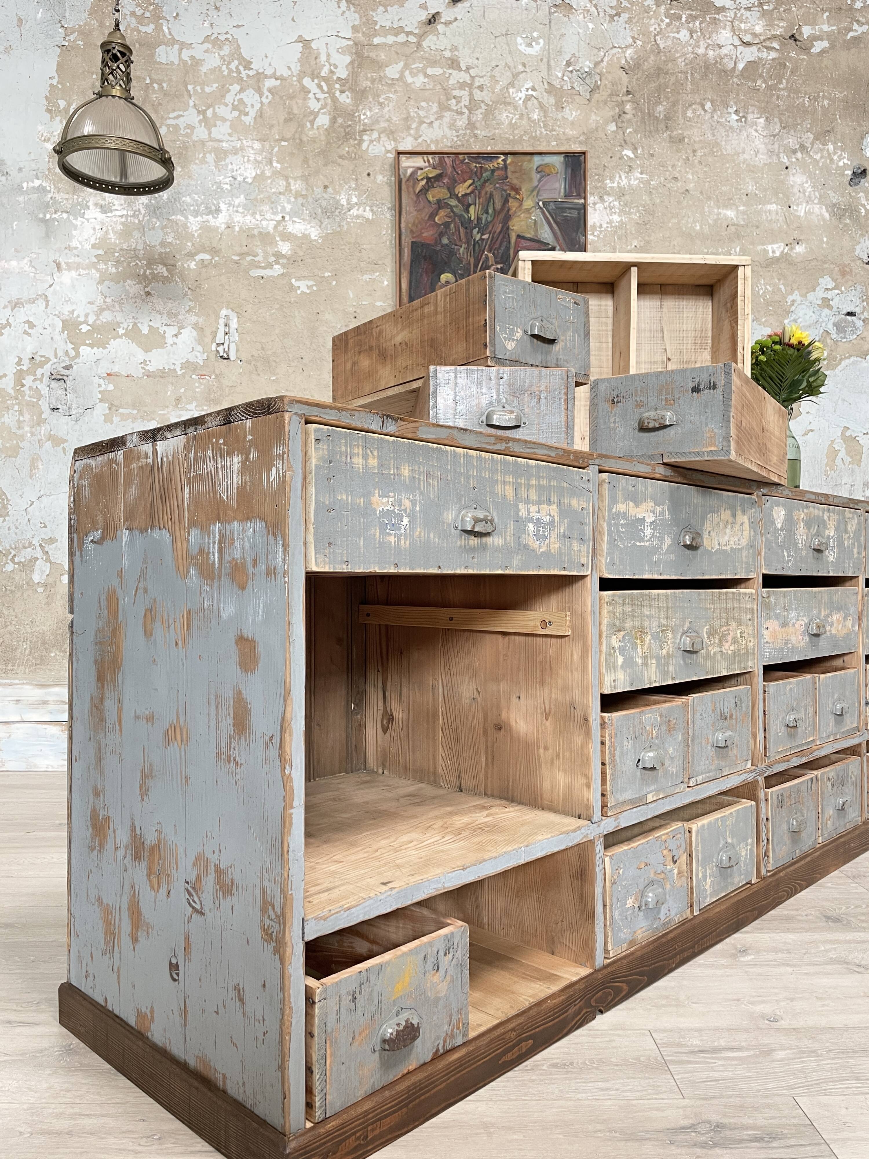 Artisanal workshop bank in patinated wood, circa 1950.