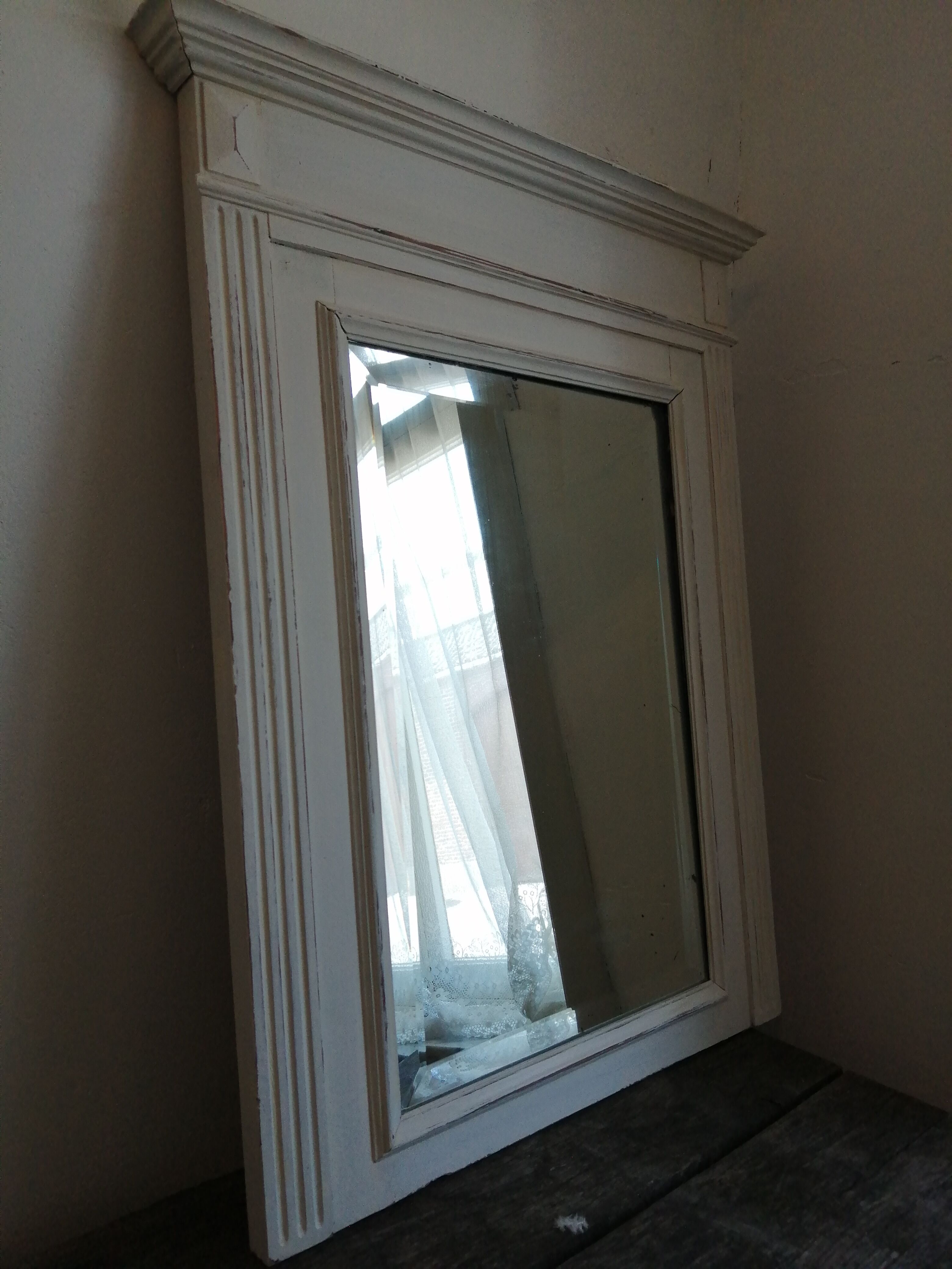 Beveled fireplace mirror